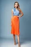 Placeholder: full body of very beautiful lady midi blue pleated skirt and orange bluse , Braided hair ,standing idle happy pose in studio pretty makeup