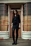 Placeholder: Photorealistic image of a young woman with dark hair, in a black skirt, leggings, boots and shirt, standing outside an old shop front with large red painted multi-paned picture windows on either side of a multi-paned doorway.