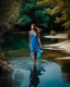 Placeholder: beautiful girl in pretty blue dress walking in water toward camera in trees next to wavy river with clear water and nice sands in floor.camera capture from her full body front