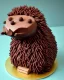 Placeholder: Hedgehog model made of chocolate cake with Mars bars