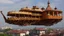 Placeholder: large wooden Victorian pleasure steamboat flying above a city, balconies, verandas