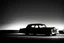 Placeholder: Coche Cadilac americano en mitad de la noche tan sólo iluminado por una farola y los faros del coche, imagen en blanco y negro vaporoso, imagen al estilo del fotógrafo Hugo Alonso