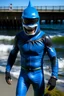 Placeholder: Surfsharks superhero costume combines a black, form-fitting bodysuit with a deep ocean-blue wetsuit-style jacket, featuring shark fin-like shoulder embellishments. White shark tooth designs adorn the arms and legs. His cowl resembles a shark's head, with a dark visor revealing his piercing brown eyes, there is a shark fin ontop of his helmet and on his back. The chest emblem is a stylized shark with dorsal fins reminiscent of Batman's bat symbol