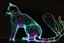 Placeholder: black background, outlines of a full-figure holographic cat, drawn from thin neon-coloured glowing lines