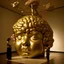 Placeholder: a huge golden inflated sculpture of brain supported by very small beautiful Asian female human bodies,complex surgical instruments,a newborn boy between light and shadow, black background,surrealism, symbolism, minimalism, sculpture by Lucian Freud, Rene Magritte, Salvador Dali