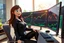 Placeholder: 3D video game character blue eyed brunette woman in black leisure suit with cute cat print on it on it enthusiastically and cheerfully watching crypto charts on big monitors in a modern room in sunshine