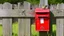 Placeholder: an old wooden fence with a little bird on it, a red old mailbox on the fence, a big note stuck on the mailbox