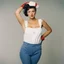 Placeholder: Dolorès Marat, La femme aux gants (Rosie the Riveter puts on her overalls over her_lingerie with gloves), 1987. go to the factory, with no inhibitions