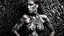 Placeholder: An artistic image depicting a woman against a textured abstract background. The woman's skin is painted with a striking black and white pattern, creating a high-contrast visual effect. The paint is applied unevenly, following a Jackson Pollock-esque pattern, covering the entire body. The background is gray with a rough texture that complements the intensity of the body paint. The overall composition is asymmetrical, emphasizing its artistic and avant-garde nature.