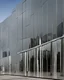 Placeholder: The museum's exterior facade is made of modern mirrors