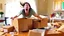 Placeholder: woman starts frantically tearing through a very large box the kitchen table was delivered in