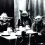 Placeholder: Creepy old photo of star wars Yoda and ewok type people sitting at dinner with scared children