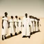 Placeholder: modern minimal photo ,In the style of William Klein, extremely thin and malnourished black African people wearing white collar dress in an arid desert landscape, color photography captured in the style of dslr camera. --ar 62:85 --v 6. 0