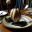 Placeholder: Garlic lands on the dining table in the balloon