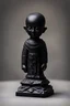 Placeholder: an ominous small statuette made of black stone, incomprehensible shape