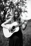 Placeholder: beautiful woman playing acoustic guitar in mid west blck and white old photto