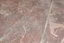 Placeholder: scratched garage floor, from very low perspective