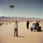 Placeholder: Archival color photograph of aliens landing at Area 51 and meeting James Dean in jaunty desert garb