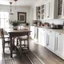 Placeholder: A farmhouse chic kitchen with white cabinets, wood accents, and a farmhouse table.