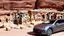 Placeholder: A Tesla's 'Model S Plaid' is parked, at Petra, in Jordan. CINEMATIC. WIDE ANGLE LENS.