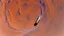 Placeholder: A Tesla semi-truck is racing at top speed, across the 'Cydonia' region, on planet Mars. CINEMATIC. WIDE ANGLE LENS.