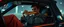 Placeholder: close up on weird out expression of guy suspended eating hot dogs inside laid back futuristic sci-fi glass human form car vampire coffin standing upright on wheels