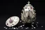 Placeholder: a silver egg in the style of Alma Pihl – that says 100 on it decorated in gems glorious beautiful