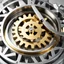 Placeholder: generate a large golden gear rotating among smaller silver gears. The golden gear should smoothly interact with the silver gears, showcasing a harmonious and synchronized movement. Implement the diffusion process in a way that the golden gear stands out in size and color, while seamlessly integrating into the overall rotation of the system.