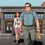 Placeholder: Cartoon of serious man walking miranda in front 4k