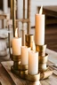 Placeholder: detail image of brass candle holders with white candles on a wooden table. modern farmhouse with rustic feeling