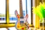 Placeholder: A lovely clear transparent resin guitar with wildflower design in a modern room in sunshine