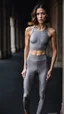 Placeholder: photography of a beautiful anorexic woman, grey satin triathlon top, brunette wavy bob haircut, pronounced sternum, flat chest, grey satin cycling leggins