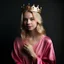 Placeholder: A beautiful woman with beautiful blond hair, wearing a modest velvet pajama, her hands are pink, and a crown is on her head.