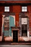 Placeholder: side of an old brick building, with windows, a doorway at the bottom, and worn out painted mural across the top