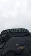 Placeholder: A dark granite stones on a top of a mountain carved a word “ SAMARRAI “ in 3D a cloudy and foggy sky