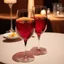 Placeholder: a table showing two wine glasses, red hues, romantic vibes