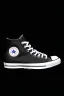 Placeholder: A black converse sneaker