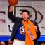 Placeholder: Jalen Brunson winning the NBA finals with the new york Knicks at Madison Square Garden and holding the MVP trophy above his head