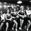 Placeholder: 1970s rhythm and blues cheerleaders in a jazz club