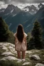 Placeholder: A young brunette woman in the alps. Her back is to the camera