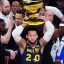 Placeholder: Jalen Brunson winning the NBA finals at Madison Square Garden and holding the MVP trophy above his head