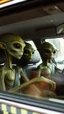 Placeholder: aliens sitting in an taxi car and the driver looking at them in the mirror