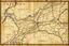 Placeholder: an ancient printed road map that was black and white and uses Cree syllabics but has since been stained and weathered