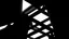 Placeholder: Black geometric shapes forming a complex structure, architectural design, strong lines, deep shadows, bright directional light.