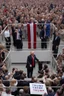 Placeholder: donald trump standing on a balcony with hundreds of people below kneeling