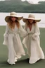 Placeholder: ((Mary-Kate and Ashley Olsen a warm hug)),Her laughter floats harmoniously with the sound of seagulls, infusing the air with a joyful melody. A vivacious energy radiates from her as she gracefully adjusts her oversized sun hat, casting a charming shadow on her sun-kissed face. The rhythmic crashing of waves seems to echo her carefree spirit.