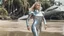 Placeholder: Middle-aged woman with blond hair in a robotic silver catsuit, standing on the right of a partially submerged sleek spaceship, on an alien beach, with alien trees