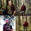 Placeholder: Georges st pierre with a red plaid shirt a jean and a military backpack in a creepy forest carrying a gun in the belt