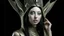 Placeholder: pale alien woman wearing a metallic alien headdress, wearing exotic clothing. Black hair bob