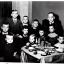 Placeholder: Creepy old photo of minecraft people sitting at dinner with weird children